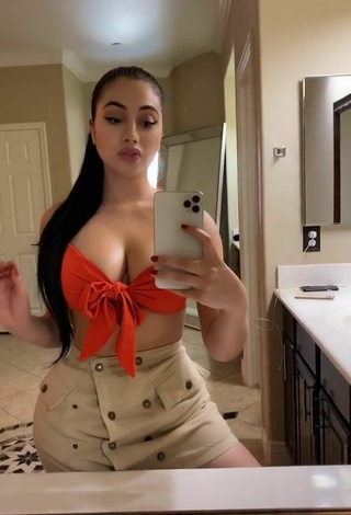 5. Sweetie Jailyne Ojeda Ochoa Shows Cleavage in Orange Crop Top