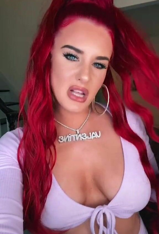 Sultry Justina Valentine Shows Cleavage in Purple Crop Top