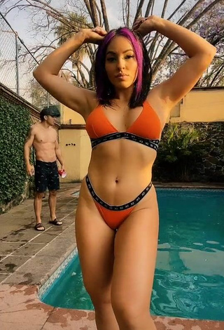 Titillating Karla Bustillos Shows Cleavage in Orange Bikini at the Pool