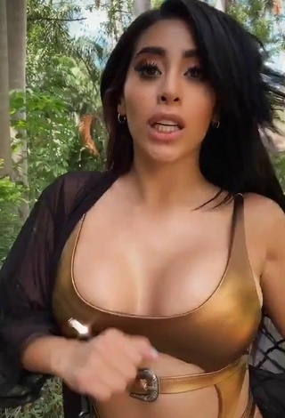 5. Titillating Kim Shantal Shows Cleavage in Golden Swimsuit