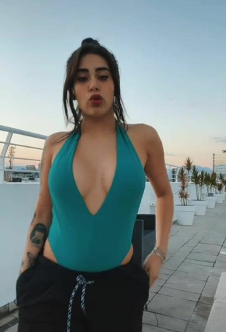 Sweetie Kim Shantal Shows Cleavage in Green Swimsuit