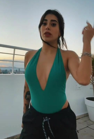 3. Luscious Kim Shantal Shows Cleavage in Green Swimsuit