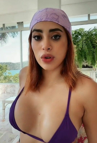 Hot Kim Shantal Shows Cleavage in Violet Bikini Top