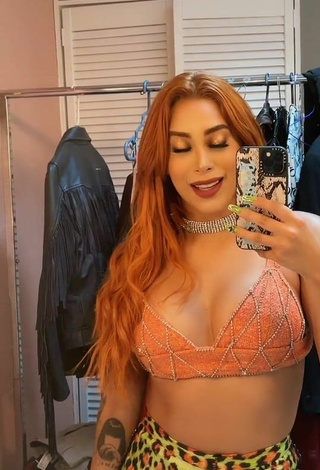 5. Hottest Kim Shantal Shows Cleavage in Orange Crop Top