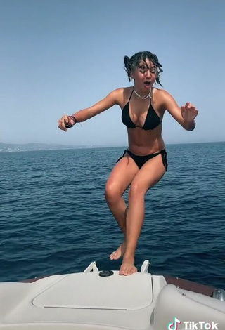 5. Sultry Larissa Kimberlly Shows Cleavage in Black Bikini on a Boat