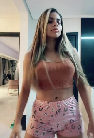 5. Titillating Lea Araujo in Orange Crop Top