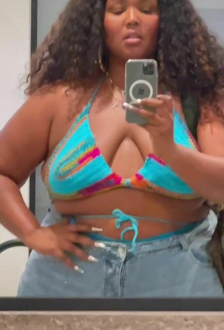 Sultry Lizzo Shows Cleavage in Bikini Top