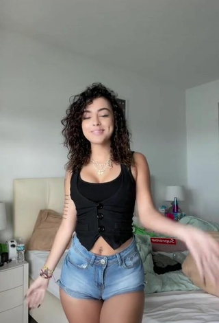 Sweetie Malu Trevejo Shows Cleavage in Black Top