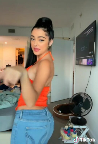 3. Cute Malu Trevejo Shows Cleavage in Orange Top