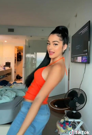 4. Cute Malu Trevejo Shows Cleavage in Orange Top