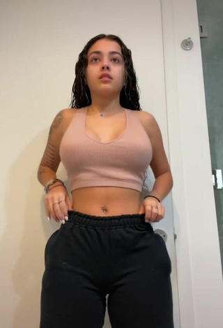 Attractive Malu Trevejo Shows Cleavage in Beige Crop Top