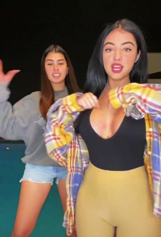 Sultry Malu Trevejo Shows Cleavage in Top at the Swimming Pool