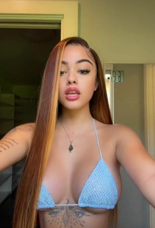 2. Erotic Malu Trevejo Shows Cleavage in Blue Bikini Top