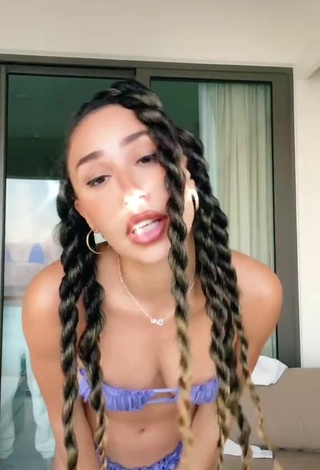 4. Sweetie Eva Gutowski Shows Cleavage in Purple Bikini