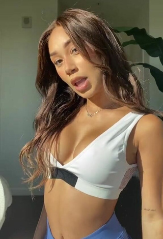 Sultry Eva Gutowski Shows Cleavage in White Sport Bra