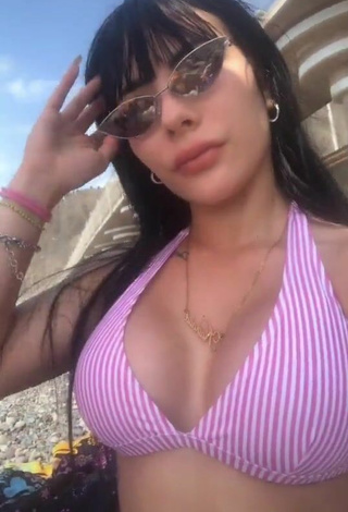 3. Titillating Natalia Shows Cleavage in Striped Bikini Top