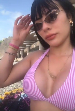 5. Titillating Natalia Shows Cleavage in Striped Bikini Top