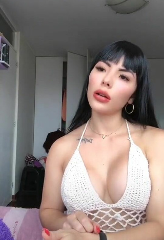 Sultry Natalia Shows Cleavage in White Hot Top