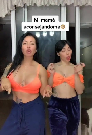 Cute Natalia Shows Cleavage in Orange Crop Top