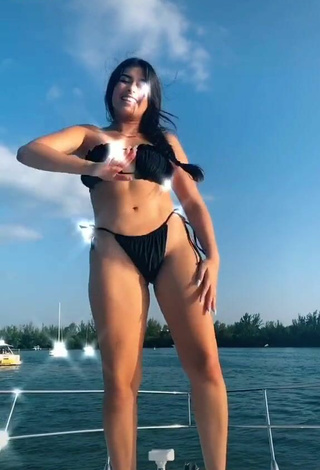 5. Cute Nicole García in Black Bikini on a Boat