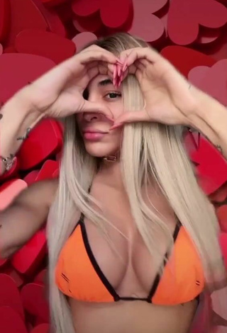 Sultry Pabllo Vittar Shows Cleavage in Orange Bikini Top