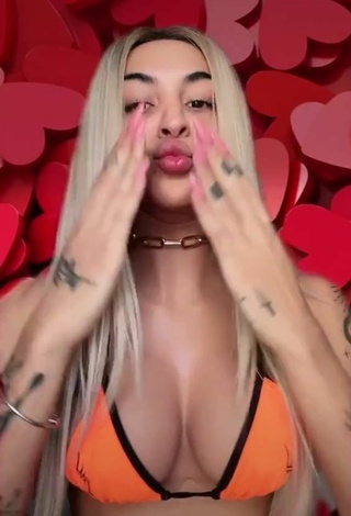 2. Sultry Pabllo Vittar Shows Cleavage in Orange Bikini Top