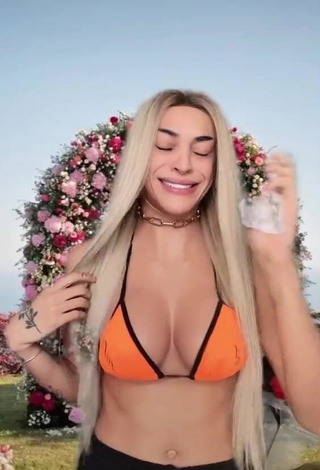 3. Sultry Pabllo Vittar Shows Cleavage in Orange Bikini Top