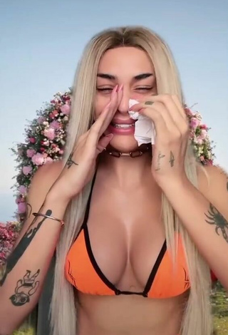 4. Sultry Pabllo Vittar Shows Cleavage in Orange Bikini Top