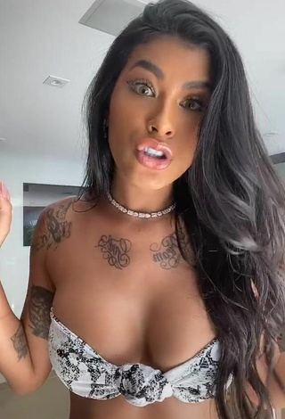 Titillating Jully Oliveira Shows Cleavage in Snake Print Bikini