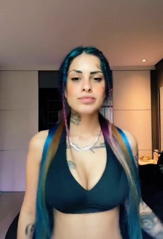 Luscious MC Tati Zaqui Shows Cleavage in Black Sport Bra