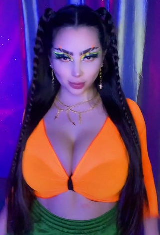 Sultry Vai Monroe Shows Cleavage in Orange Crop Top and Bouncing Boobs