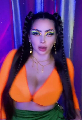 5. Sultry Vai Monroe Shows Cleavage in Orange Crop Top and Bouncing Boobs