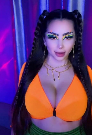 6. Sultry Vai Monroe Shows Cleavage in Orange Crop Top and Bouncing Boobs