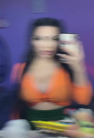 2. Sexy Vai Monroe Shows Cleavage in Orange Crop Top