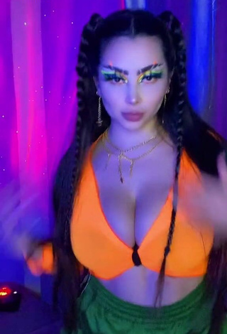 Cute Vai Monroe Shows Cleavage in Orange Crop Top