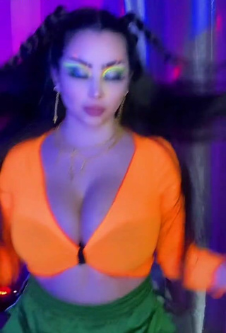 2. Cute Vai Monroe Shows Cleavage in Orange Crop Top