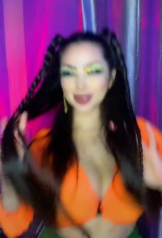 6. Titillating Vai Monroe Shows Cleavage in Orange Crop Top and Bouncing Boobs