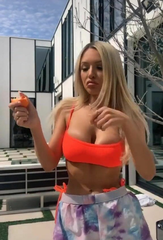 4. Luscious Abby Rao Shows Cleavage in Orange Bikini Top