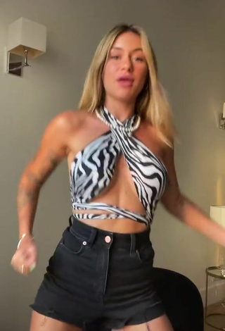 2. Alluring Abril Cols Shows Cleavage in Erotic Zebra Crop Top