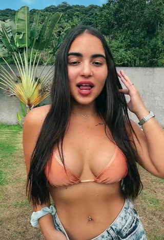 Sweetie Aline Borges Shows Cleavage in Peach Bikini Top