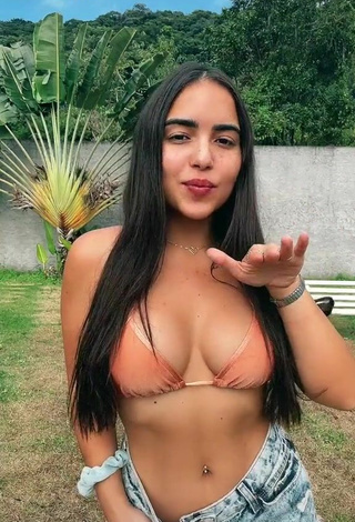 2. Sweetie Aline Borges Shows Cleavage in Peach Bikini Top