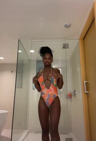 Sultry Angel Ogbonna Shows Cleavage in Swimsuit