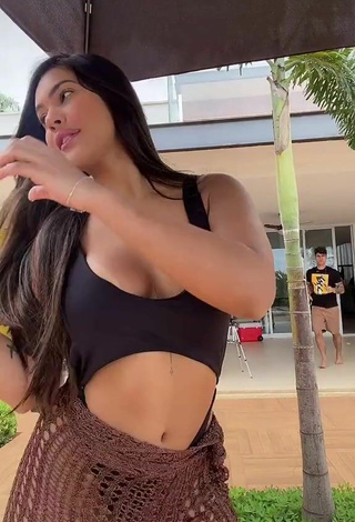 2. Sultry Ayarla Souza Shows Cleavage in Black Swimsuit