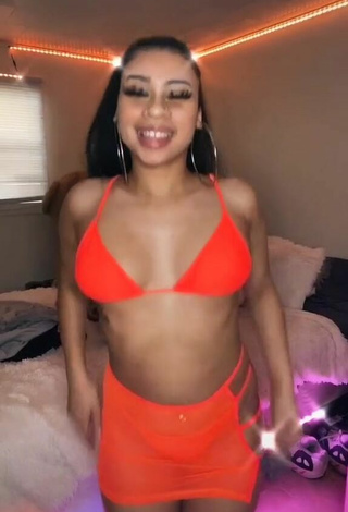 2. Titillating BbygShai in Electric Orange Bikini Top