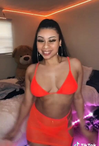 3. Titillating BbygShai in Electric Orange Bikini Top