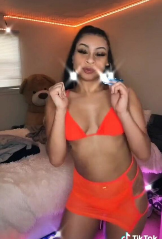 4. Titillating BbygShai in Electric Orange Bikini Top