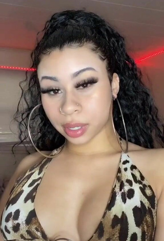 Titillating BbygShai Shows Cleavage in Leopard Crop Top