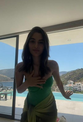 Sultry Cagla Simsek in Green Swimsuit at the Pool