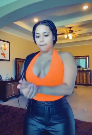 5. Luscious Carmen Pritchett Shows Cleavage in Electric Orange Top