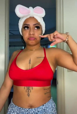 Sultry Carmen Pritchett Shows Cleavage in Red Sport Bra